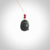 This picture shows a small sized Black Obsidian stone skull pendant that we have hand carved. It is polished to a soft shine and is a very striking piece. Provided with an adjustable meringue coloured cord.